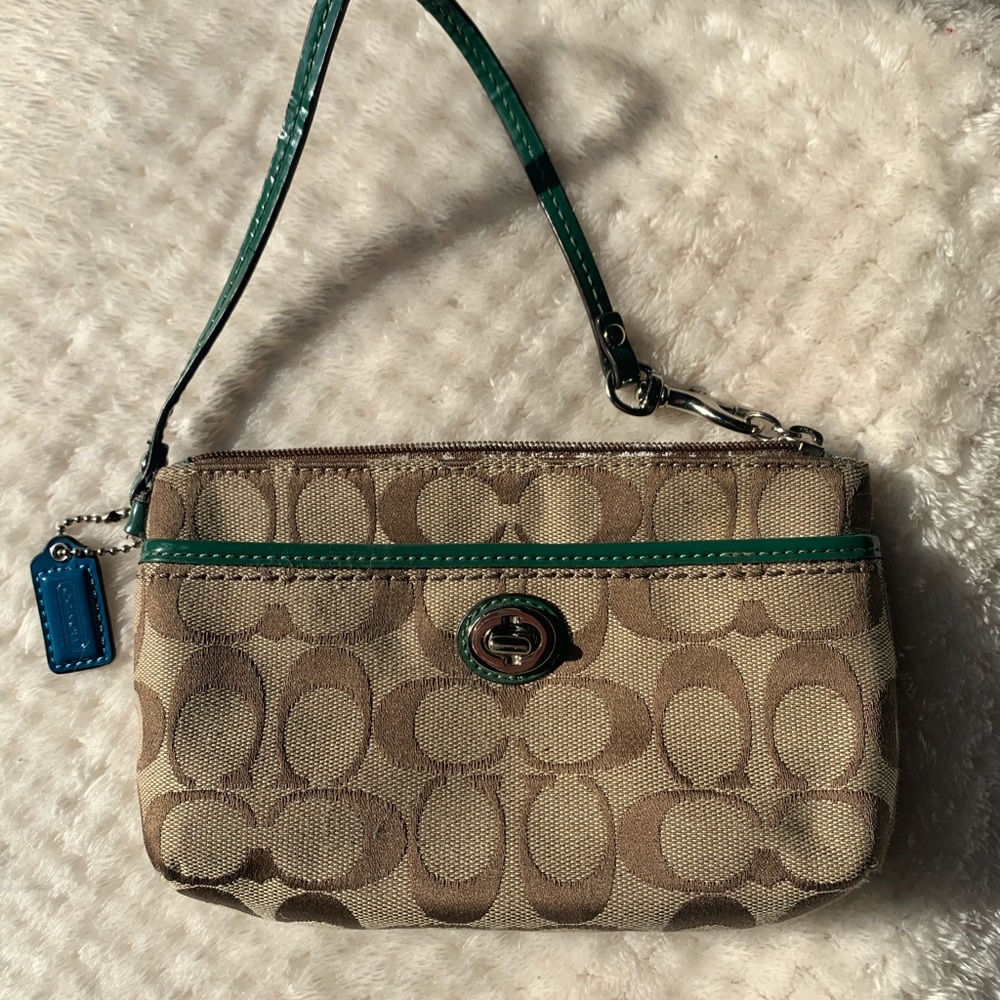 Signature Coach Wristlet with Green Accent Leather